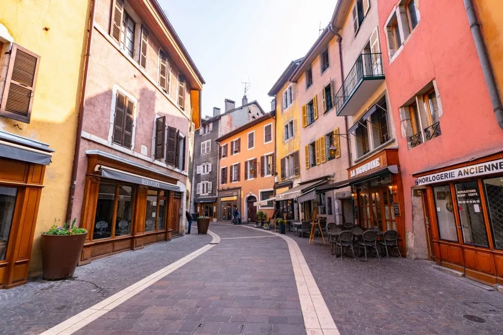 Pedestrian street lined with colorful buildings in Annecy