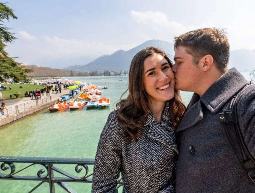 Selfie of couple on Lover's Bridge in Annecy, one of the best places to visit in Annecy