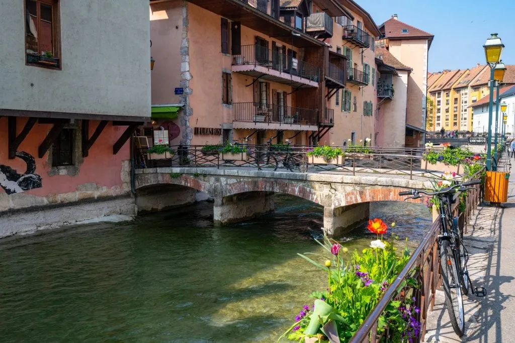 Canal lined with flowers in Annecy, France