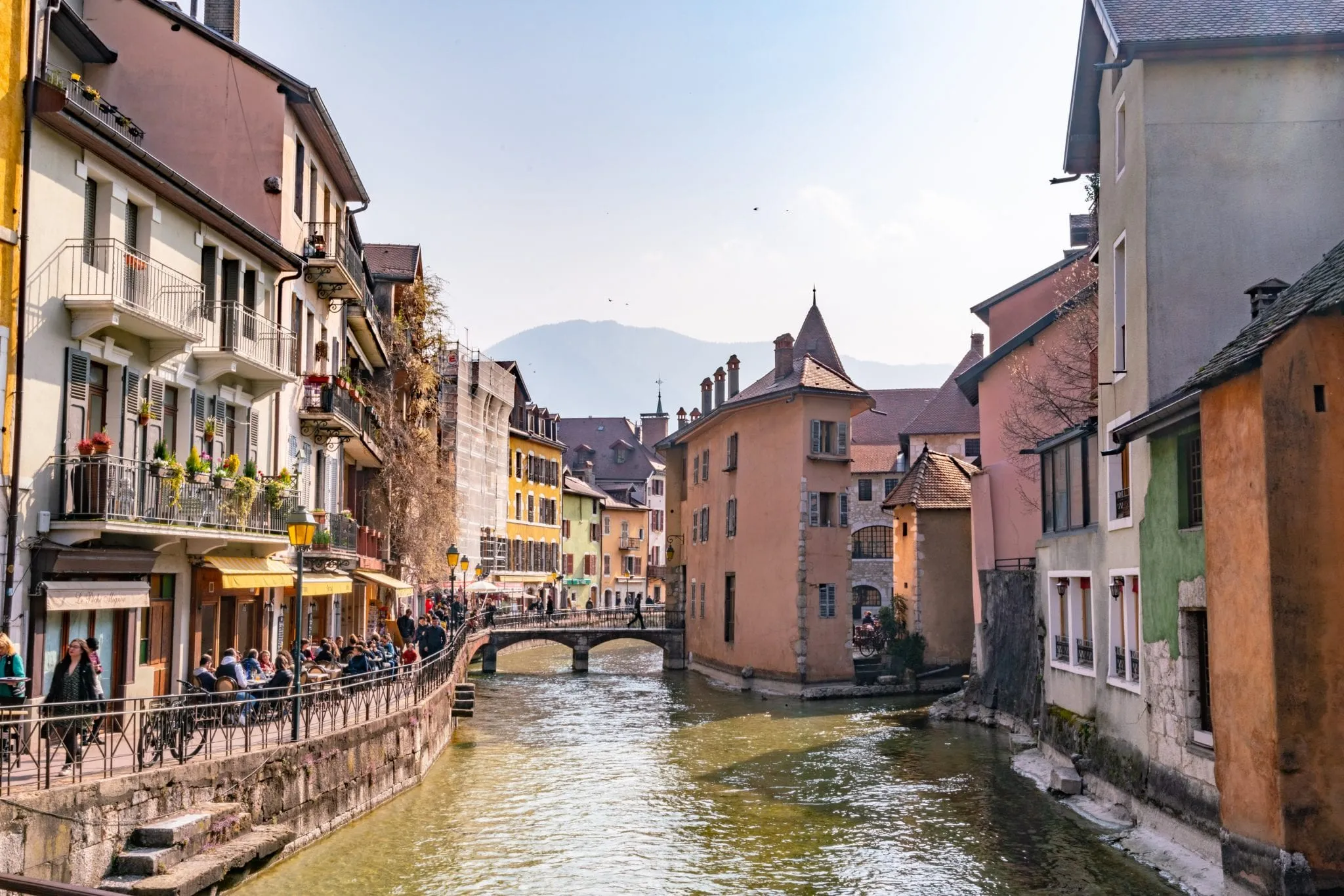 Photo of canal in Annecy France--leaving major cities to see beautiful towns like this is one of our top tips for traveling Europe!