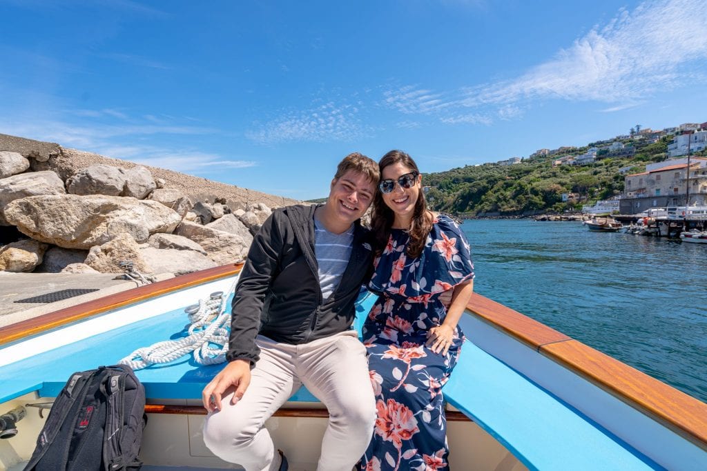Couple on the bow of a boat bound for a day trip to Capri