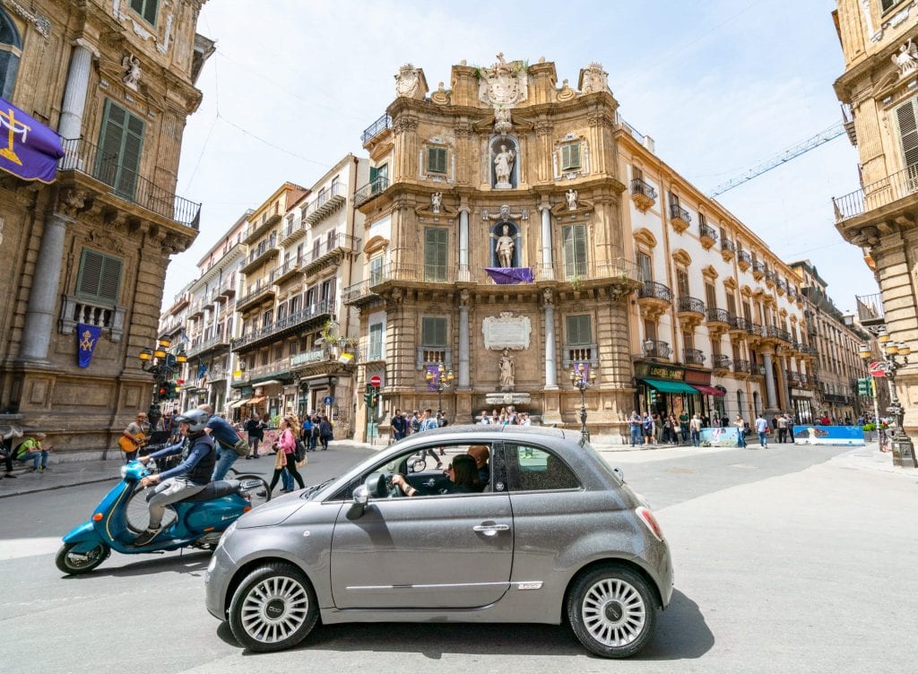 Car and Vespa in Quattro Canti, Palermo