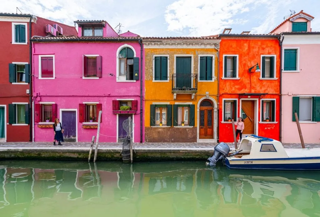 colorful houses in burano italy on a cloudy day