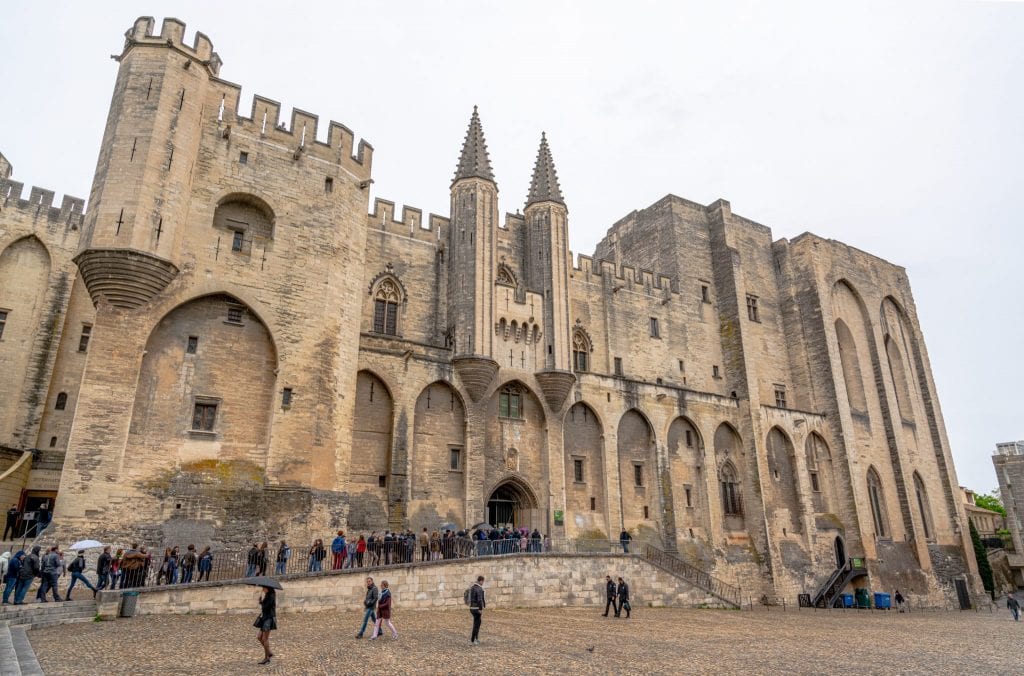 Exterior of the Papal Palace in Avignon France on a cloudy day.