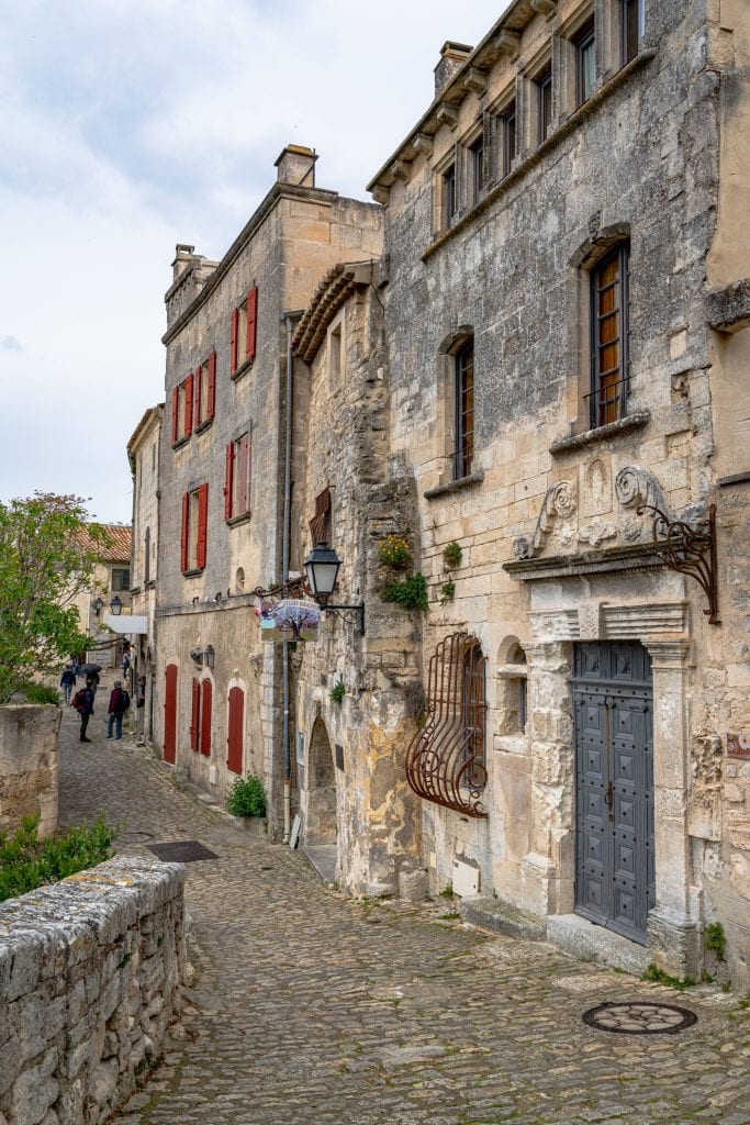 cobblestone streets and stone buildings in les baux de provence, one of the most beautiful places in france to visit