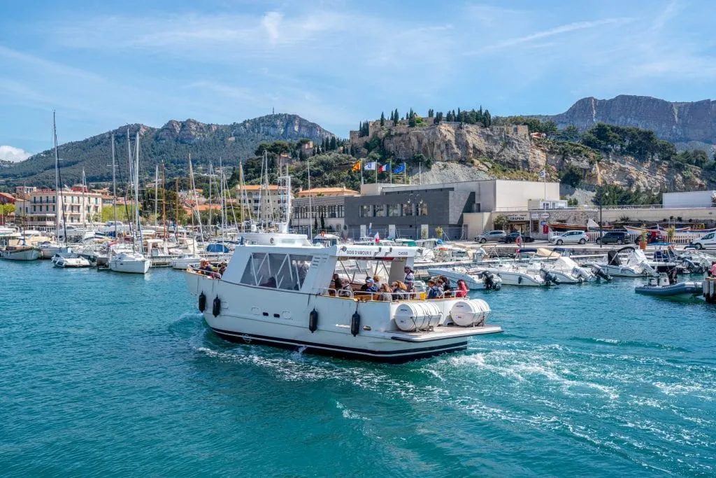 Tour boat driving through Port de Cassis