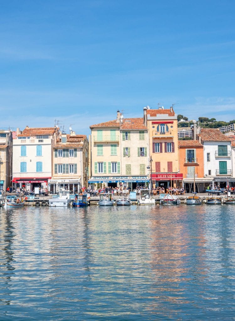 photo of cassis france as taken from across the harbor, one of the most beautiful towns in south of france