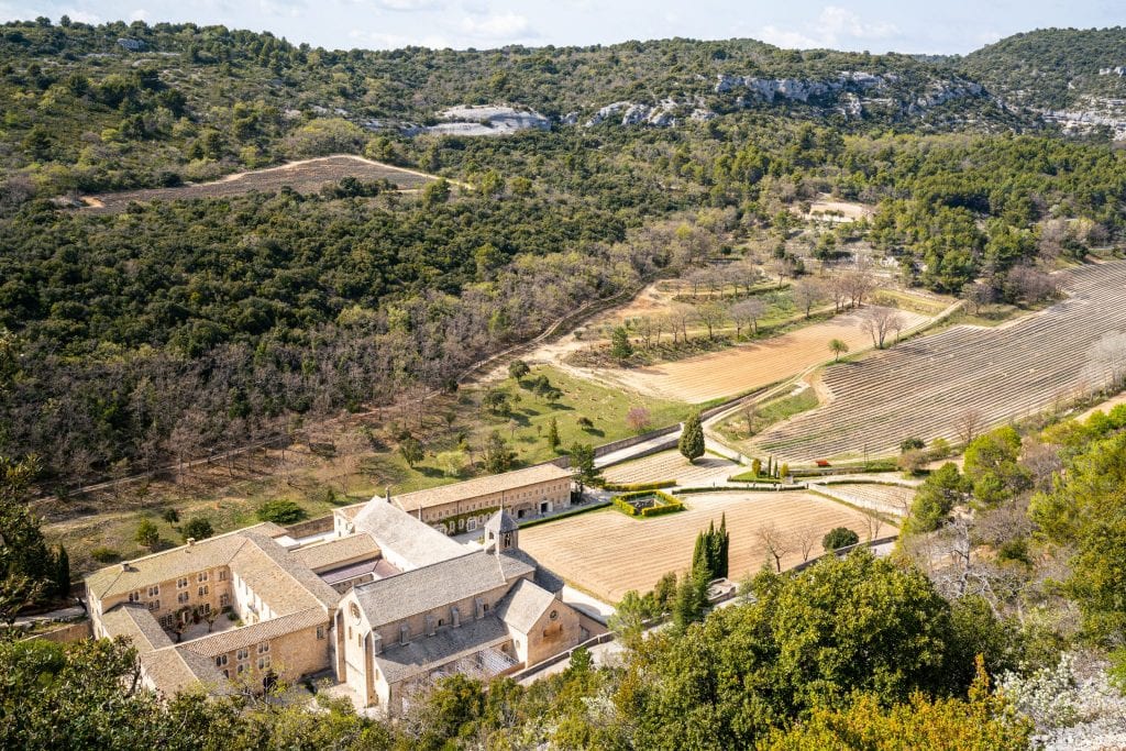 Senanque Abbey shot from above--the abbey is in the bottom left of the shot with lavender fields to the right--definitely stop here on your France road trip!