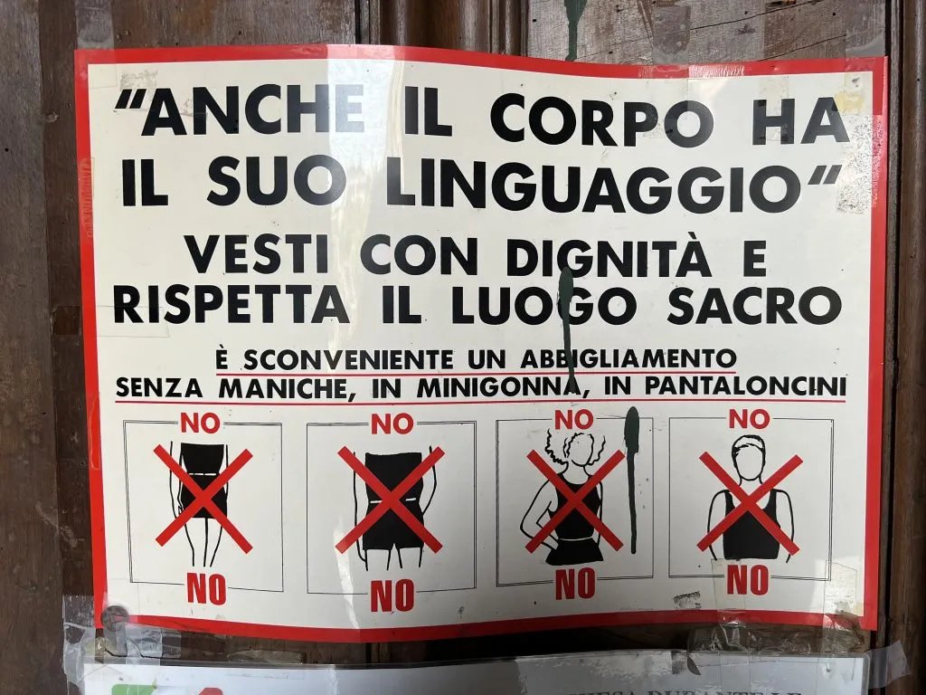 dress code sign illustrating how to dress in a church in trastevere rome