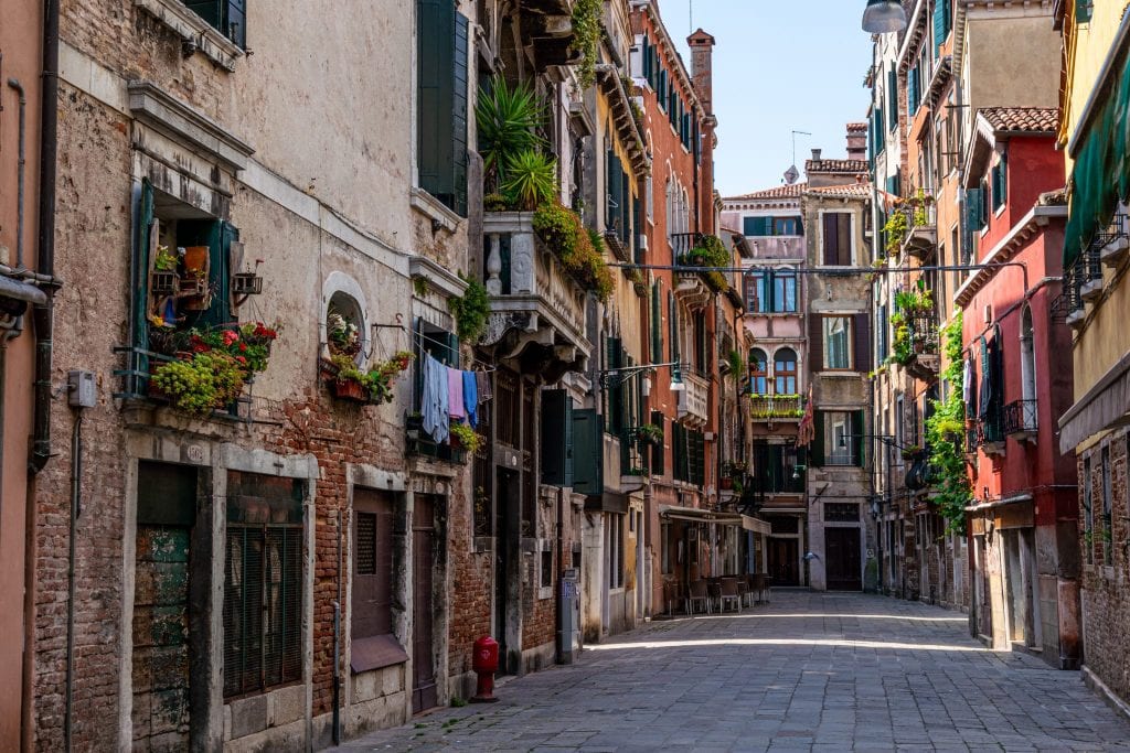 Quiet street in Venice with flowers in windows
