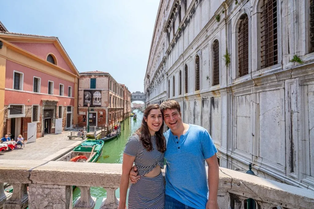 Couple in front of Bridge of Sighs in Venice
