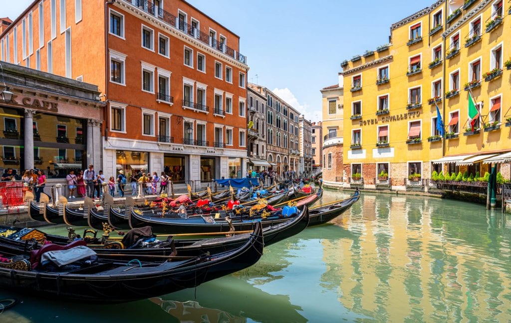 Series of gondolas parked in a canal in Venice--one of the most interesting facts about Italy is that there are far fewer gondolas in the city today than in the past