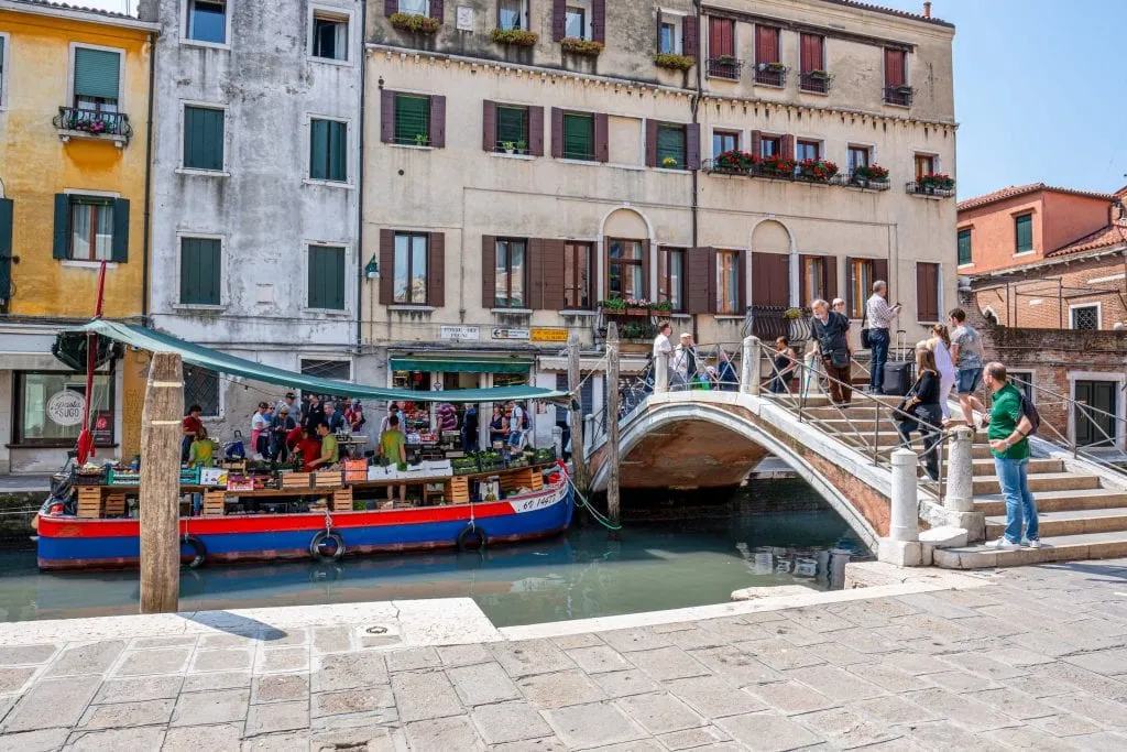 Ponte dei Pugni on the right side of the photo in Venice with Dorsoduro vegetable barge visible on the left