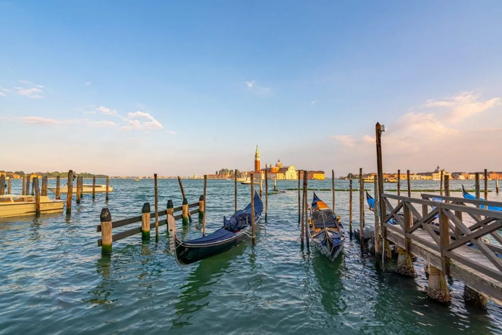 Gondolas in the Venetian Lagoon with San Giorgio Maggiore in the background--don't miss this spot when looking for the most instagrammable places in Venice!