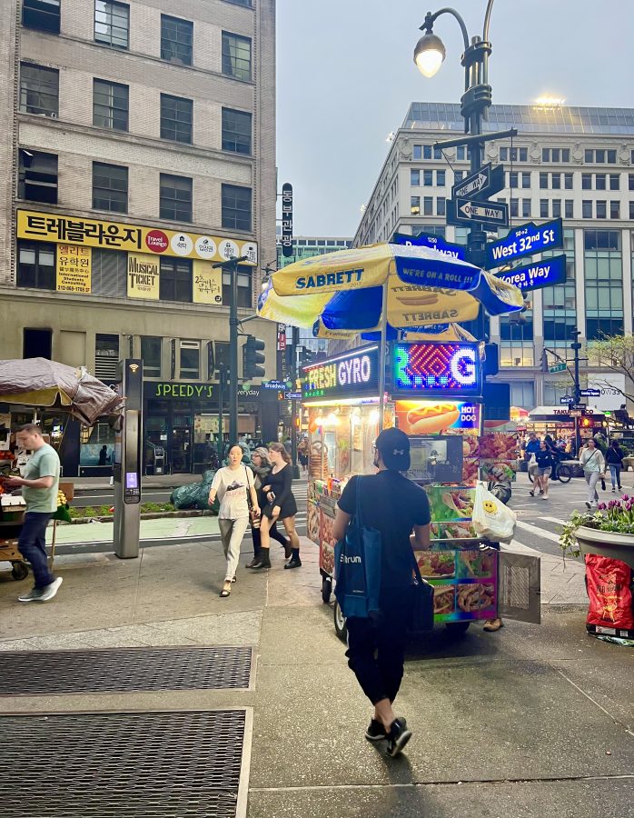 street scene in koreatown nyc with food truck in the center