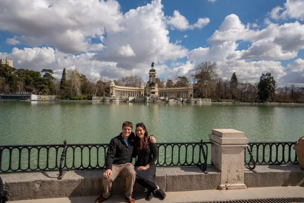 Kate Storm and Jeremy Storm in front of Retiro Park Lake