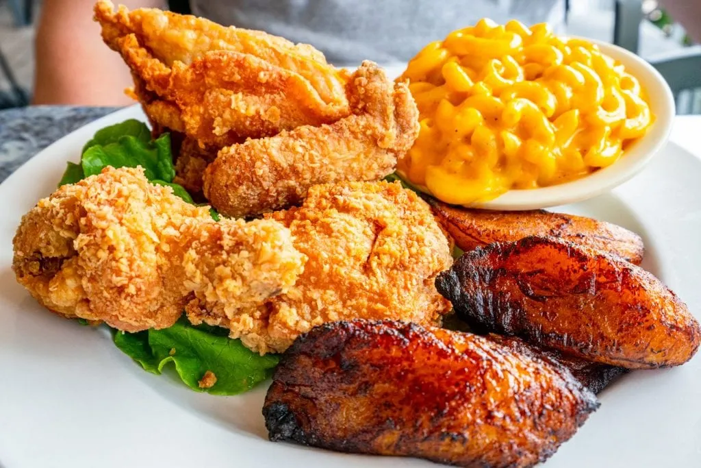 Plate of fried chicken, sweet plantains, and macaroni and cheese, as served at 11th Street Diner in Miami Beach.