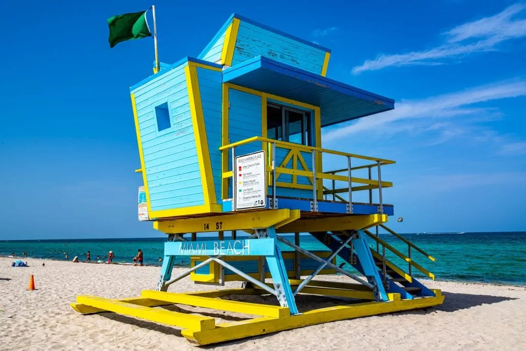 Blue and yellor art deco lifeguard stand on South Beach in Miami, which is a must-see beach for your USA bucket list!