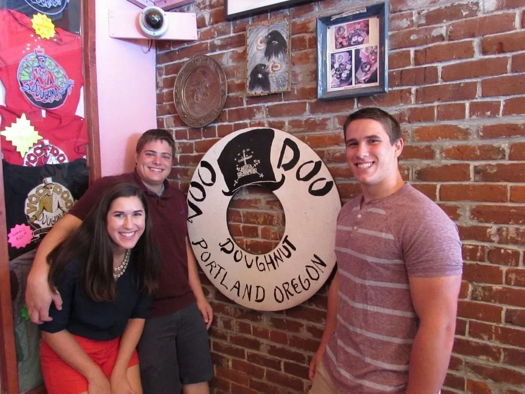 Kate Storm Jeremy Storm and Jack Wodarski in Voodoo Donuts in 2014 in Portland Oregon