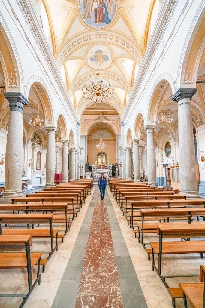 kate storm in a blue shirt in the village of francavilla, a personal italy bucket list destination