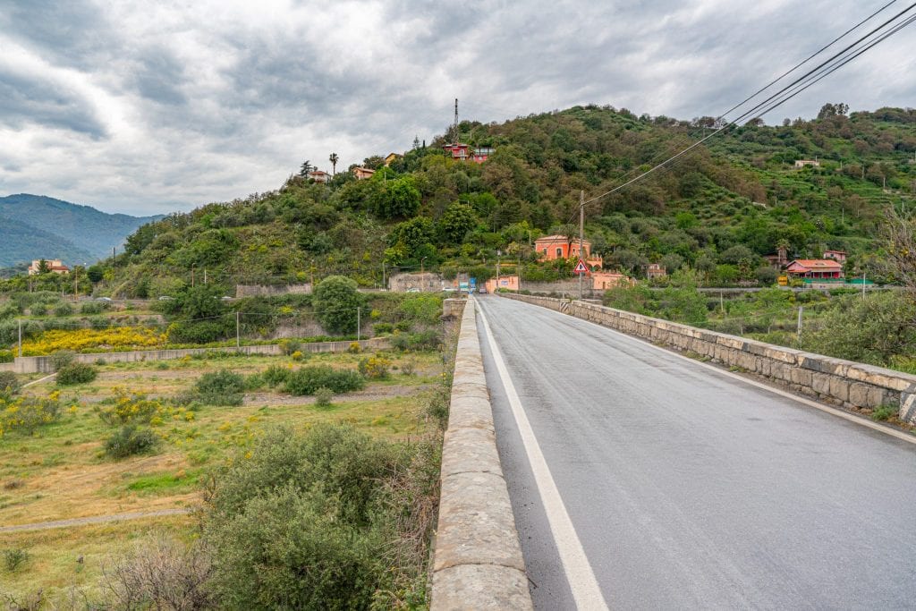 Empty road in Sicily with green fields on either side