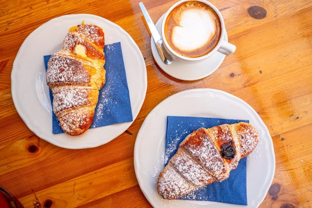 Pastry and cappuccino breakfast in Syracuse Sicily shot from above