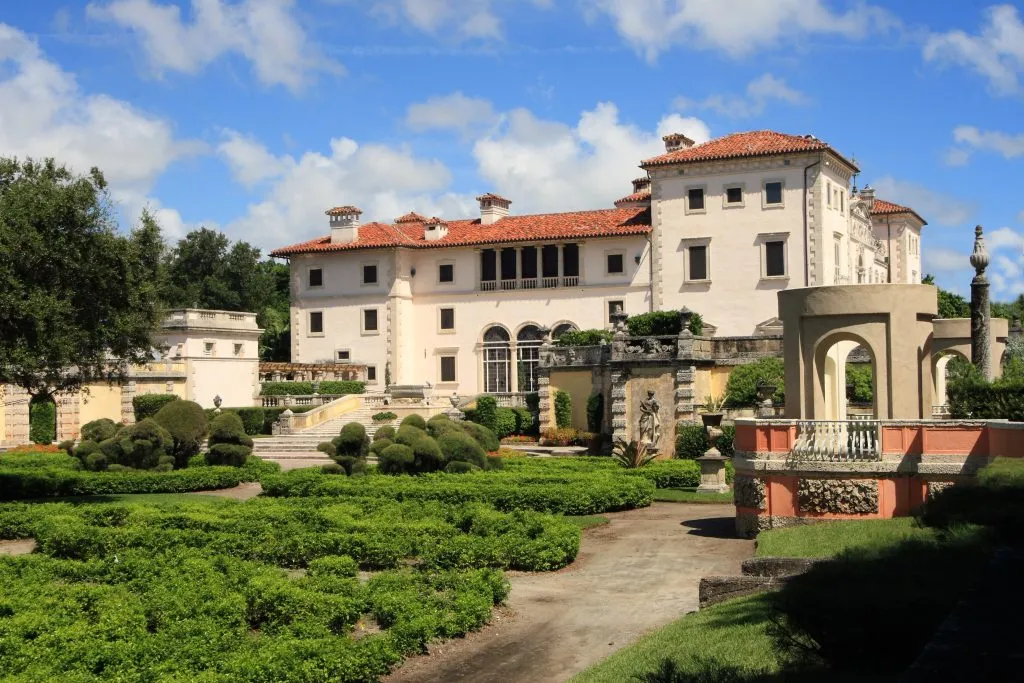 vizcaya mansion as seen from the gardens, one of the best things to do over a long weekend in miami florida