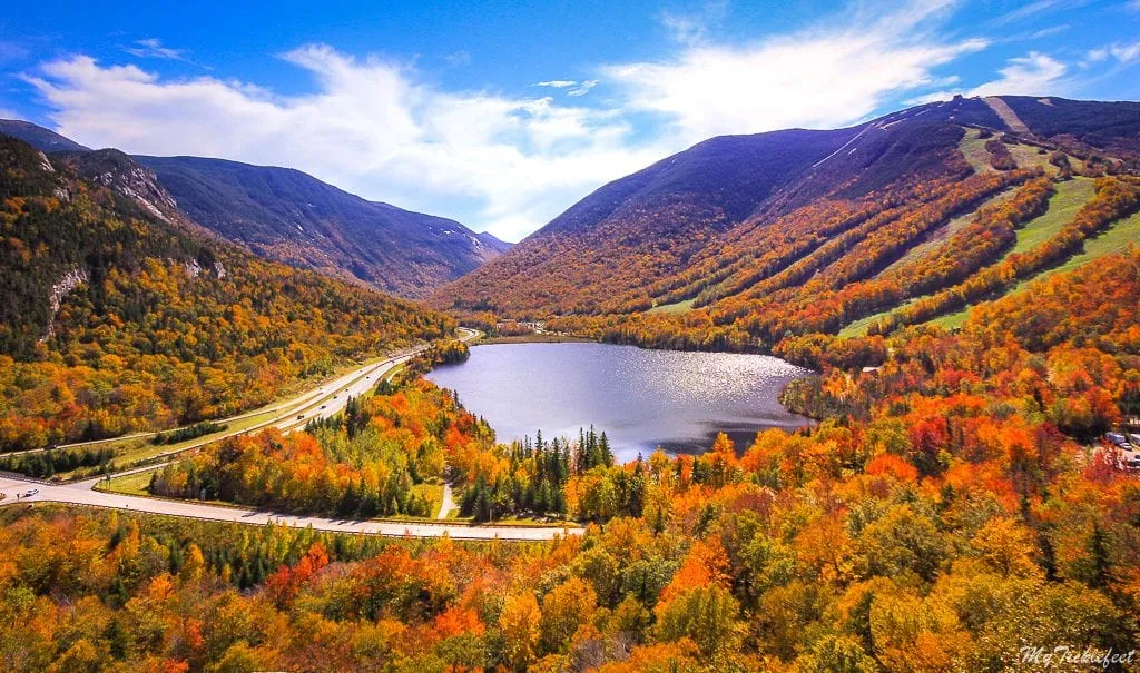 Echo Lake from above surrounded by fall foliage--absolutely one of the best places to visit in New England!