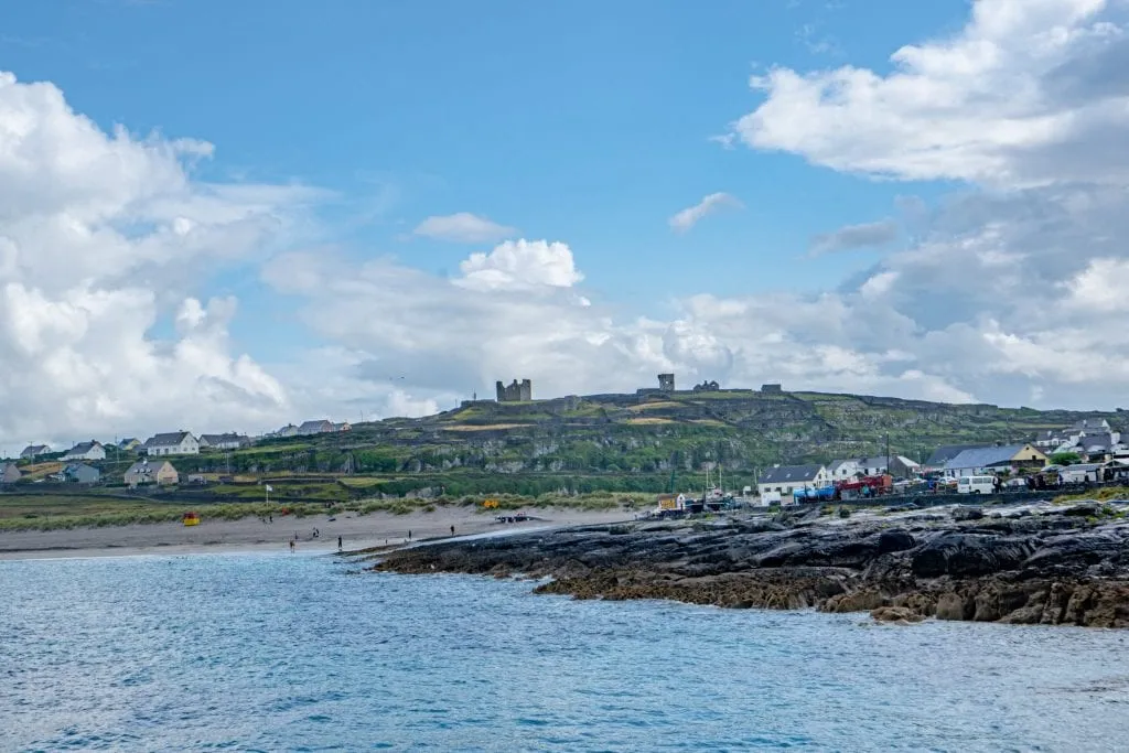 View of Inisheer Island with O'Brien's Castle perched at the top--visiting O'Brien's Castle is one of the best things to do on Inisheer Ireland!