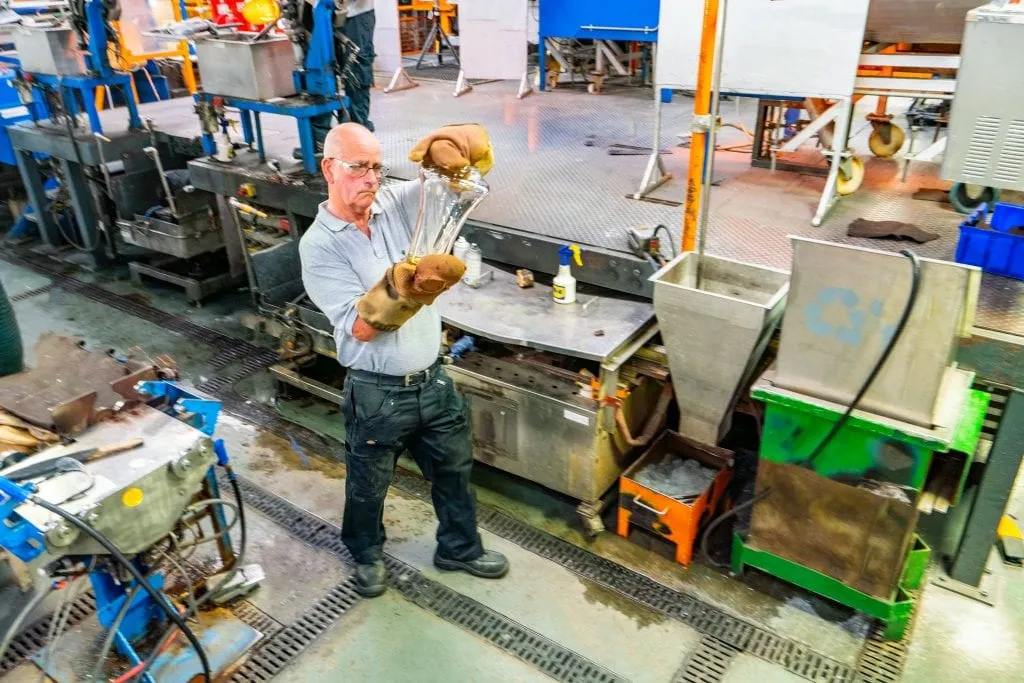 Glassblower working in the Waterford Crystal Factory--a tour here is definitely worthy of a place on your 10 day Ireland itinerary