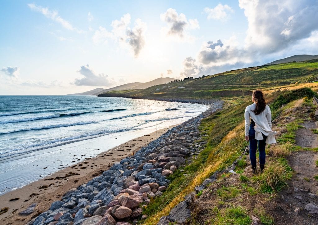 Kate Storm standing next to Inch Beach on Dingle Peninsula Ireland near sunset