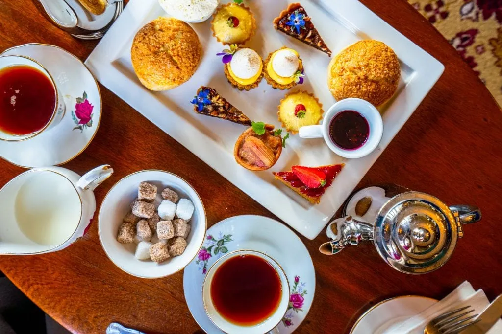 Traditional afternoon tea service shot from above at Belleek Castle--experiences like this are definitely worth keeping in mind when putting together your Ireland travel budget