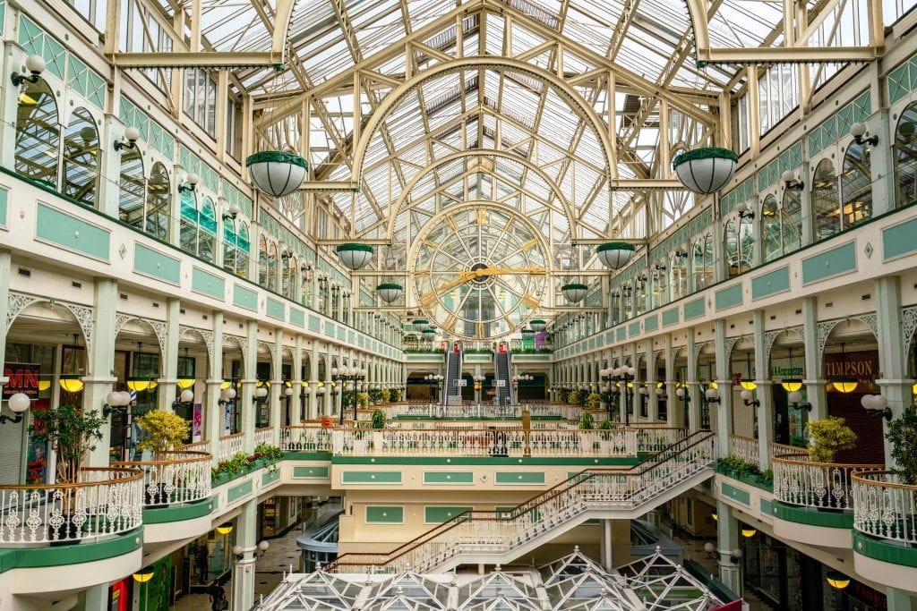 Interior of St Stephen's Green Shopping Centre with clock in the center of the photo