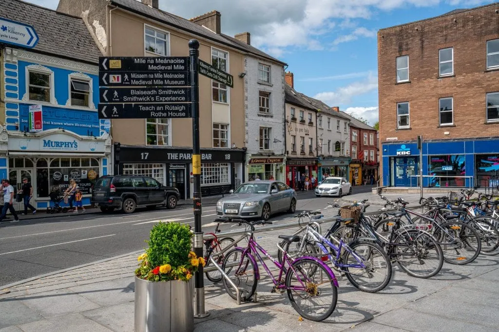 Colorful street in Kilkenny Ireland with bikes parked on the righthand side. Kilkenny is among the top day trips from Dublin Ireland