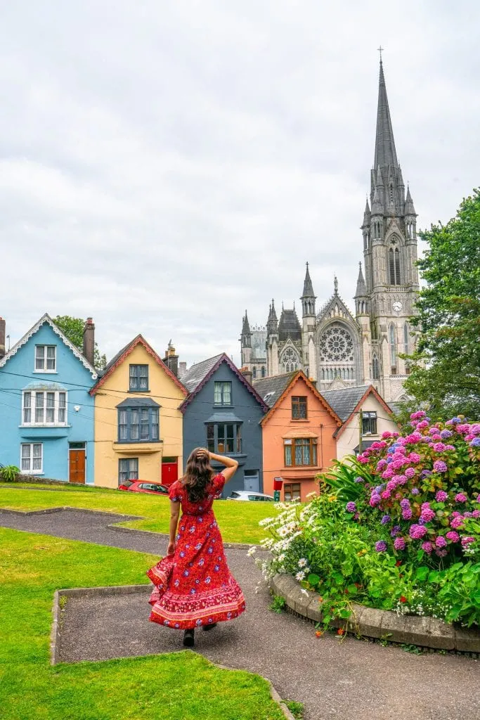 Kate Storm in Cobh Ireland wearing the red dress recommended on this packing list for Ireland