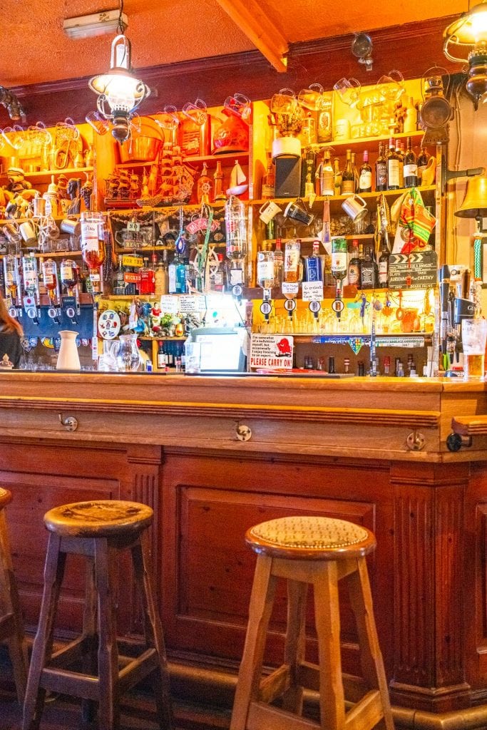 Interior of McCarthy's Bar in Ireland, with liquor bottles on the back wall