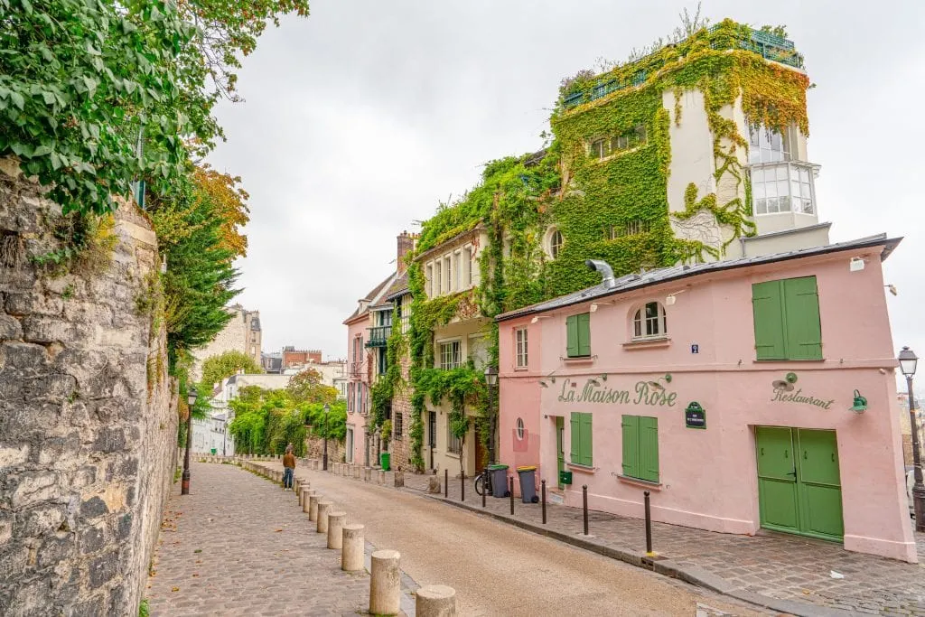 La Maison Rose on Montmartre next to an empty street--definitely a pretty stop along the way during your 2 days in Paris France!