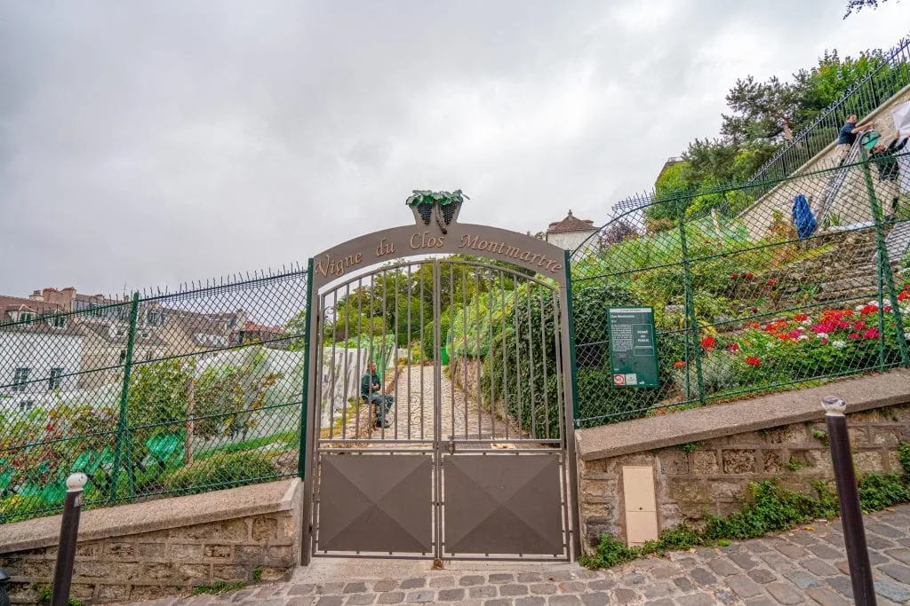 Locked gate of Le Clos Montmartre, the secret Paris vineyard that's worth tracking down in Montmartre.