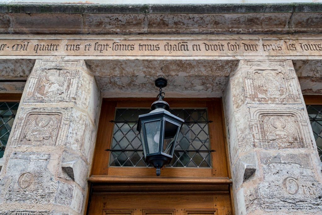 Close up of the carvings over the door of Nicholas Flamel's house, a great spot to visit when looking for hidden gems in Paris!