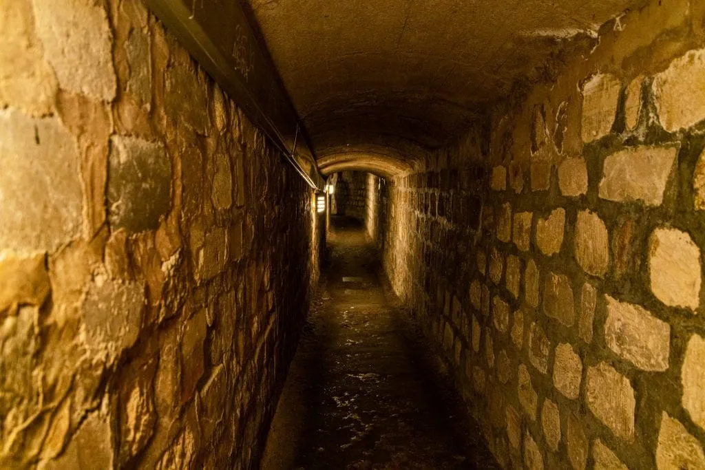 Narrow passage in the Paris catacombs