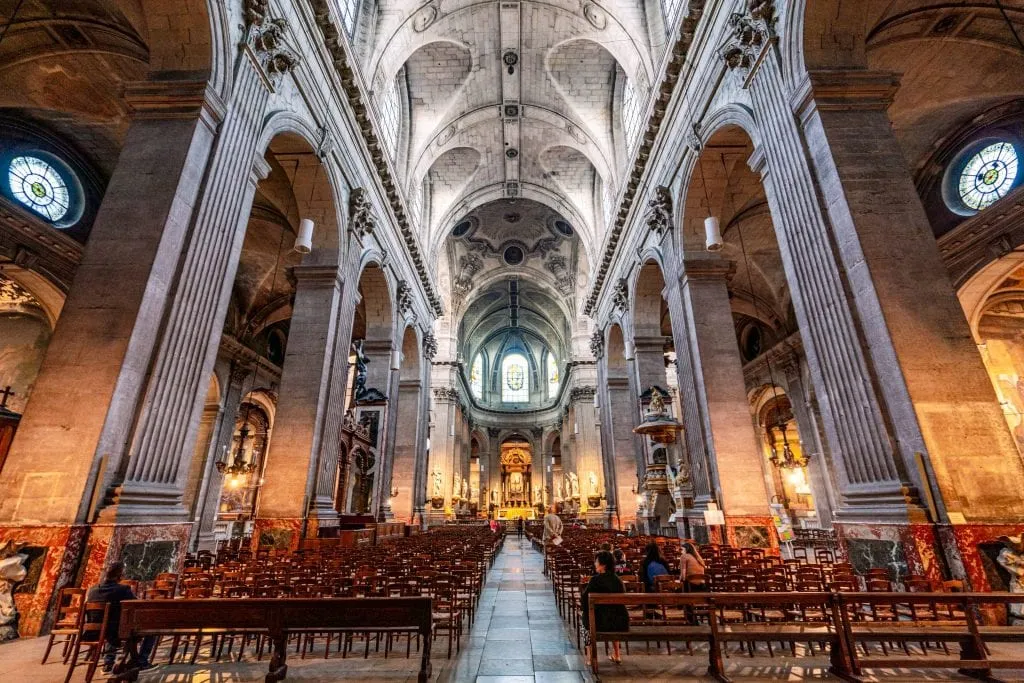 Interior of Church of Saint Sulpice in Paris--when trying to learn how much a trip to Paris costs, keep in mind that many gorgeous spots like this are free to visit!