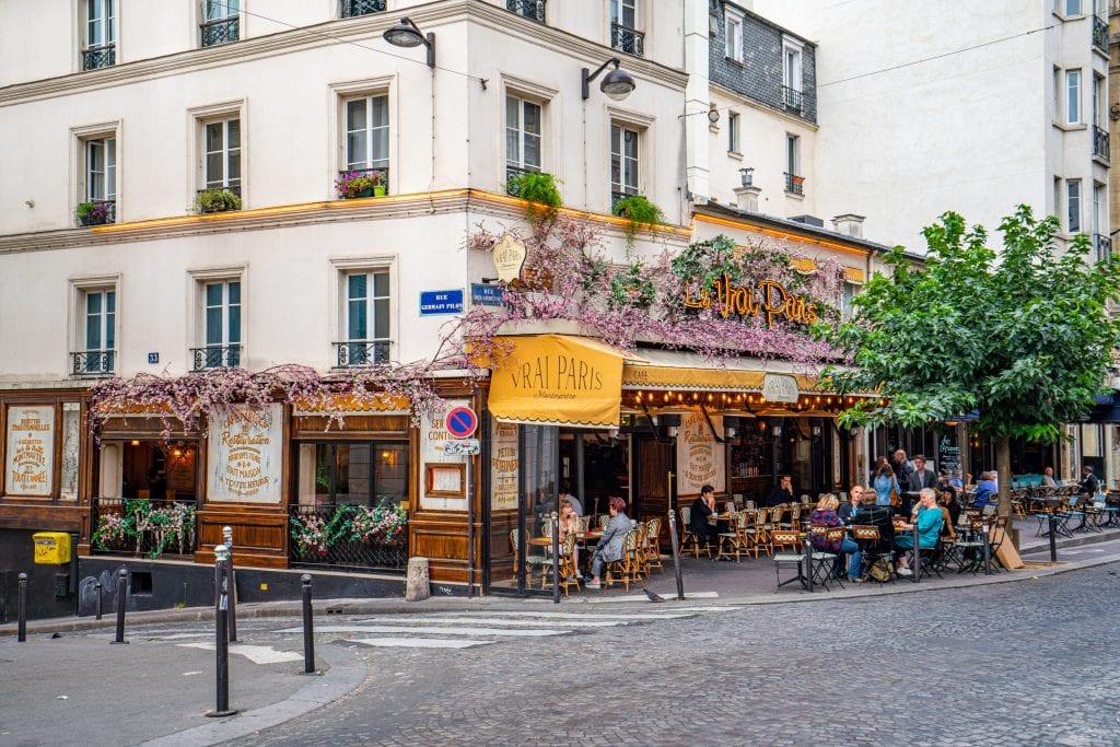 street in montmartre with cafe in the distance