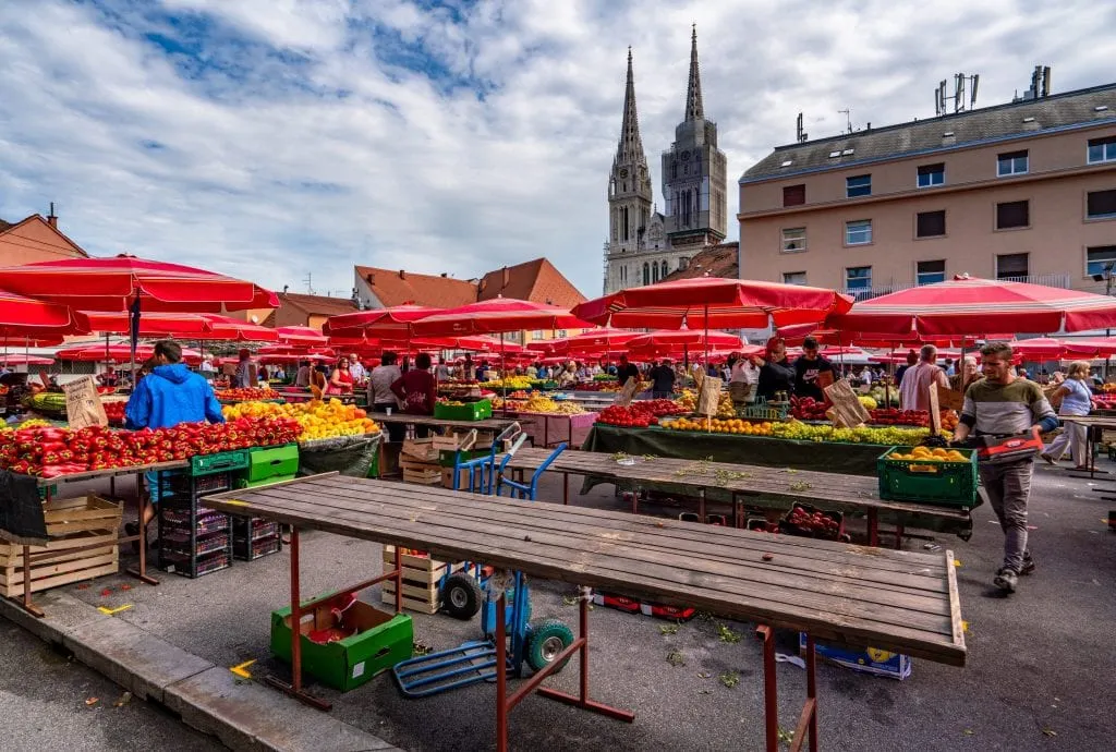 Photo of Dolac Market shaded by red umbrellas, a must-see on a one day in Zagreb itinerary