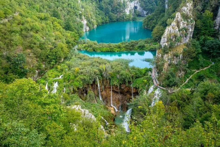 Plitvice Lakes National Park Croatia postcard view from above with lakes in the center surrounded by trees, a must-see on your 10 day trip to Croatia!