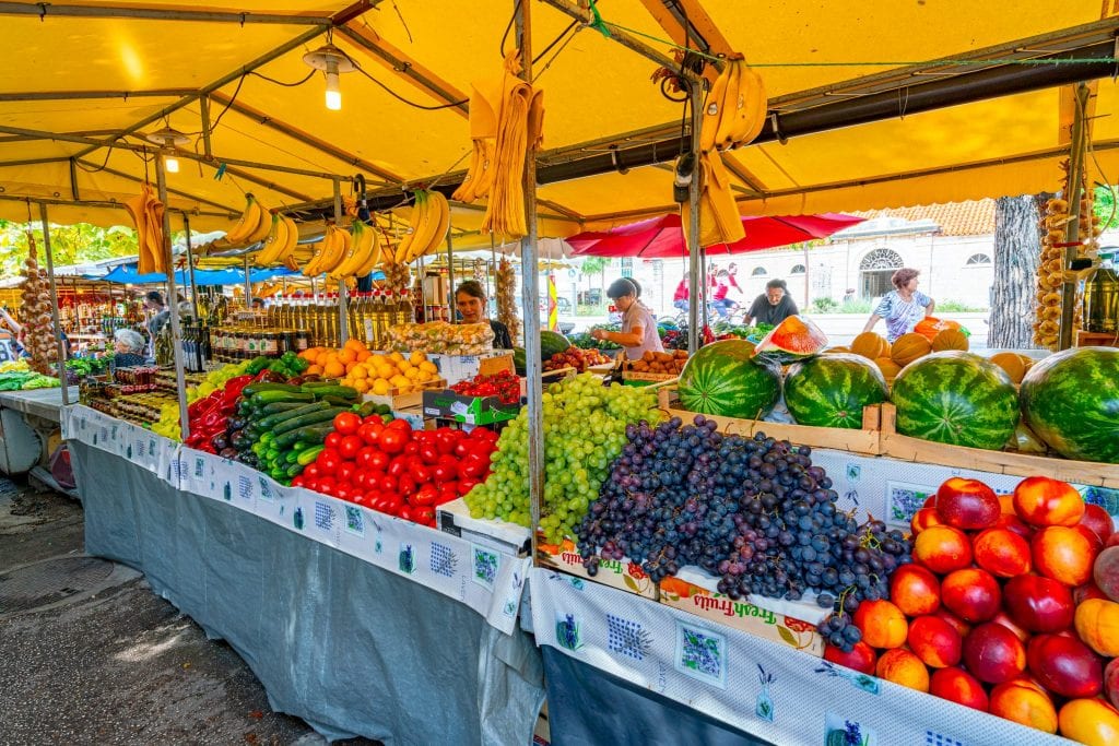 produce for sale at a market in croatia: is croatia expensive? the fruit definitely isn't.