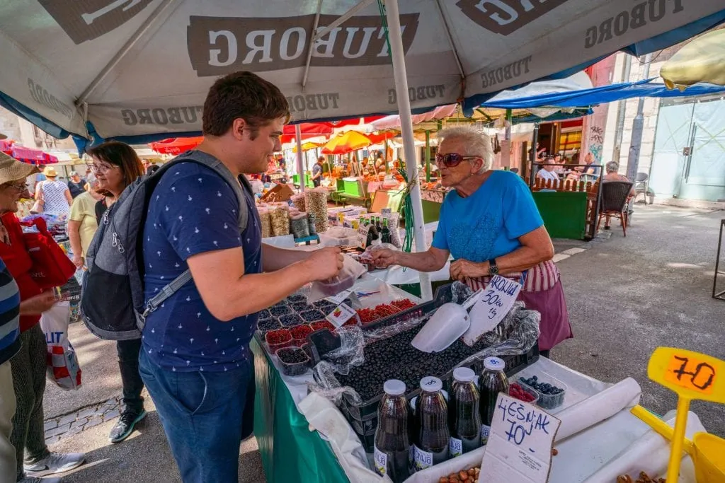 Jeremy Storm purchasing raspberries at the Pazar Market during a trip to Split Croatia