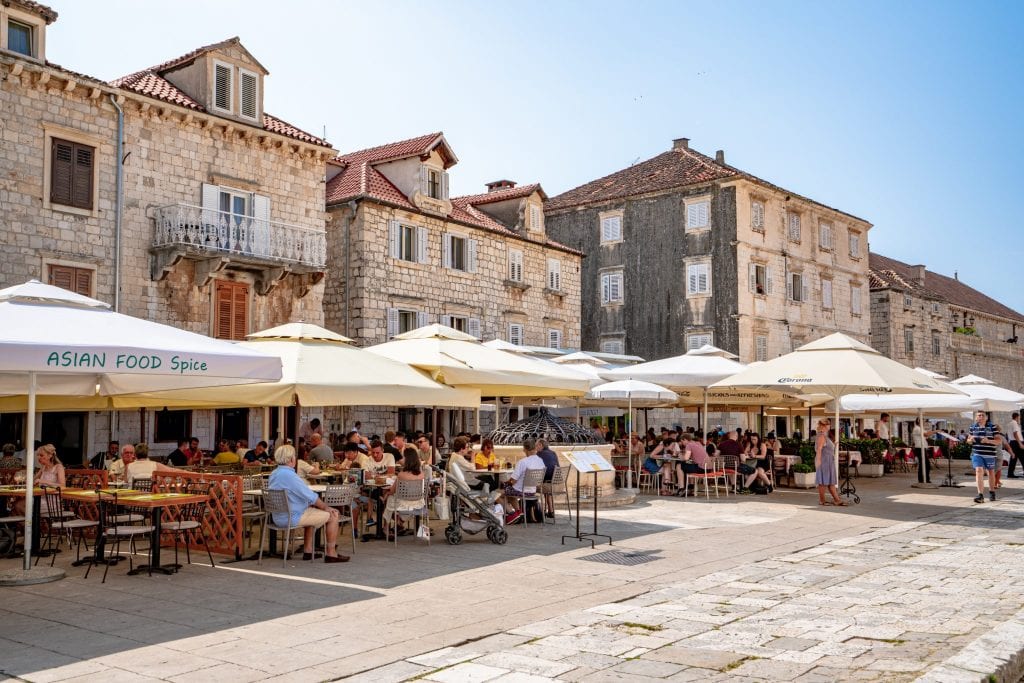 Restaurants lining a stone street in the main square of Hvar Croatia