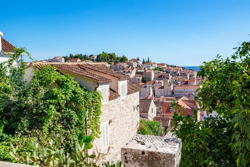 Photo of rooftops near the top of Hvar Croatia--seeking out views from above is one of the most fun things to do in Hvar Croatia