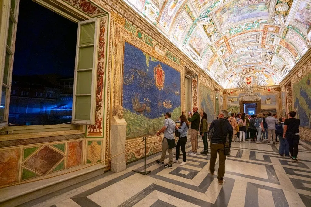 vatican tour today Map room in the Vatican Museums shot at night, with open window on the left. Visiting the Vatican Museums during special hours is one of our favorite travel tips for Rome Italy!
