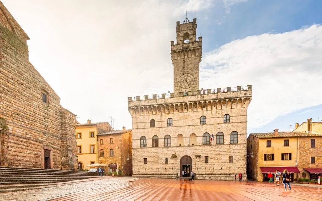 Piazza Grande in Montepulciano right after a rainstorm--this Tuscan town is absolutely worth visiting as part of your Tuscan road trip itinerary.